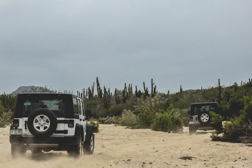 High Tide Los Cabos adventure tour - two 4x4 jeep driving through the desert on a guided tour