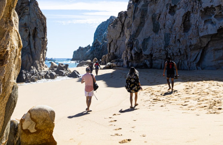 People walking on the beach in Los Cabos